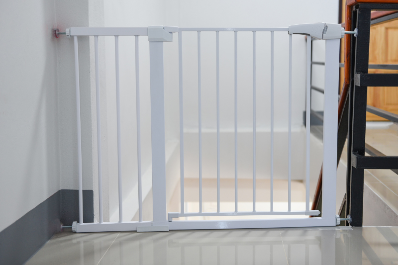 use a baby gate for senior pets to prevent them falling downstairs
